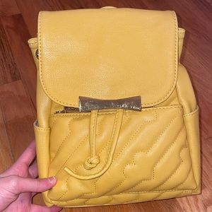 Betsy Johnson mustered yellow backpack in great condition new with tags